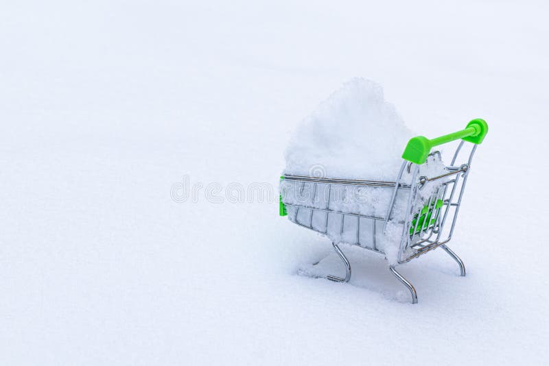 A Green Shopping Cart with Snow Inside Stock Image Image of freezing