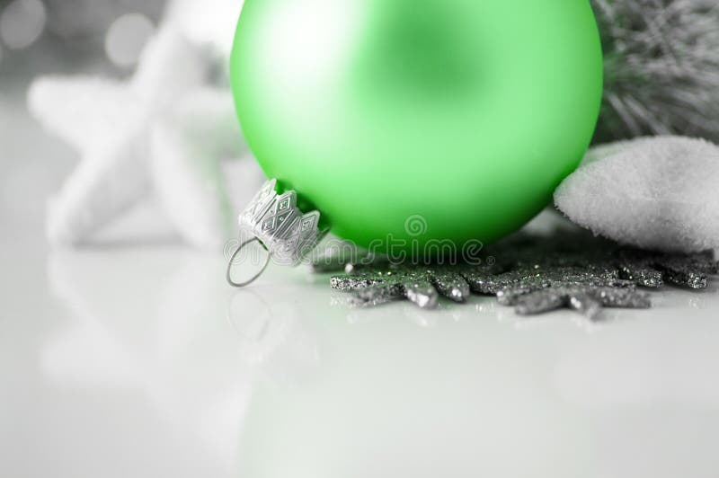 Green and silver xmas decoration on white backgrou