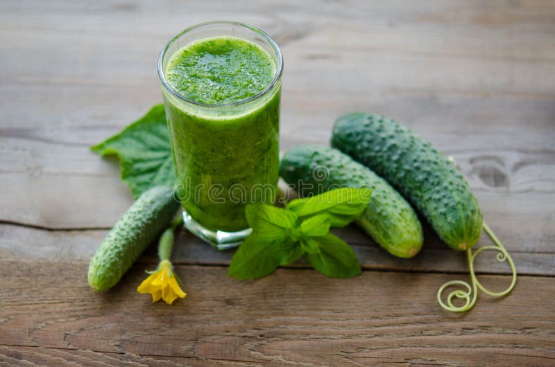 Green smoothie with cucumber and mint as healthy summer drink