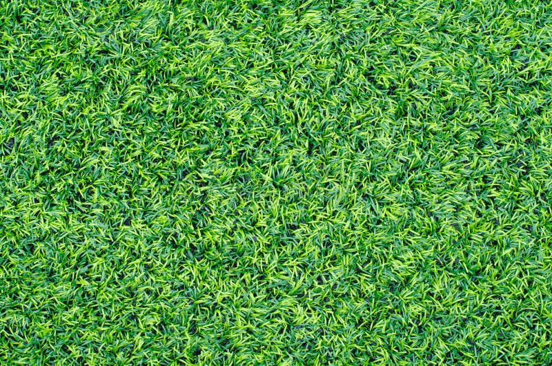 Green synthetic grass sports field