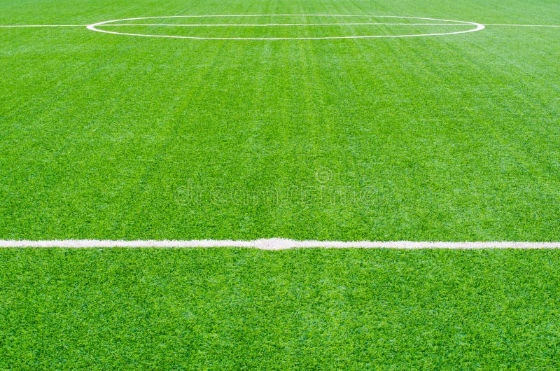 Green Synthetic Grass Sports Field with White Line Stock Photo