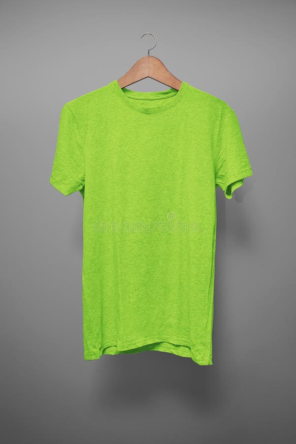 Green T-Shirt on a Hanger Against a Light Blue Background Stock Image ...