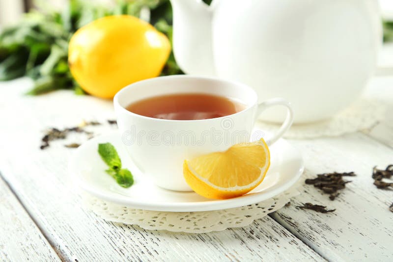 Green Tea In Cup And Teapot On White Wooden Background Stock Image