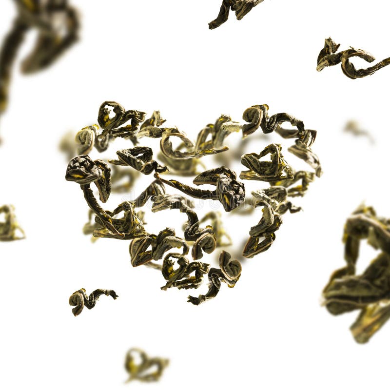 Green Tea Leaves in Flight in the Shape of a Heart Stock Photo Image