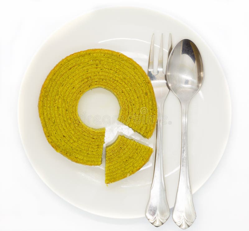Green tea multiple layers cake on white disk royalty free stock photos