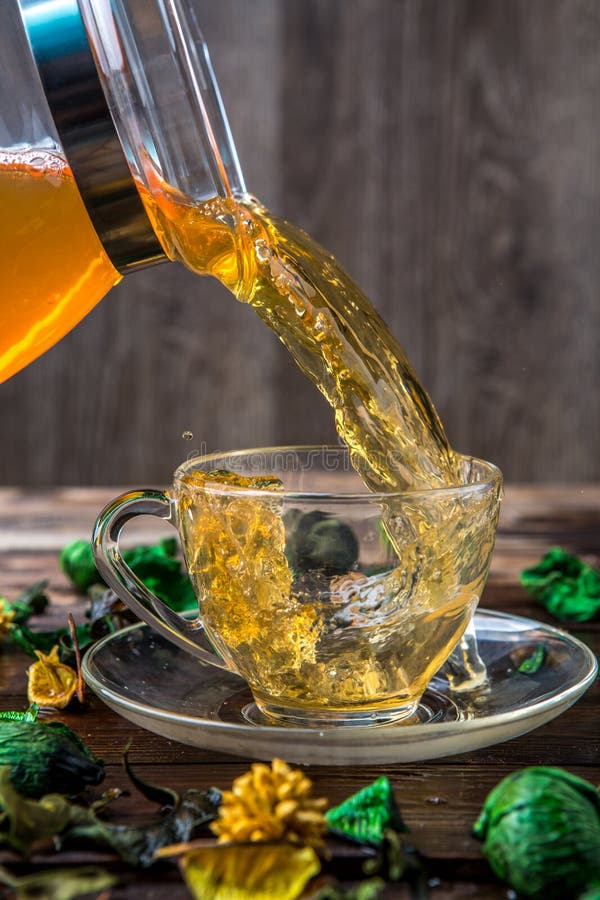 Green tea poured into cup stock photo. Image of heat 83869100