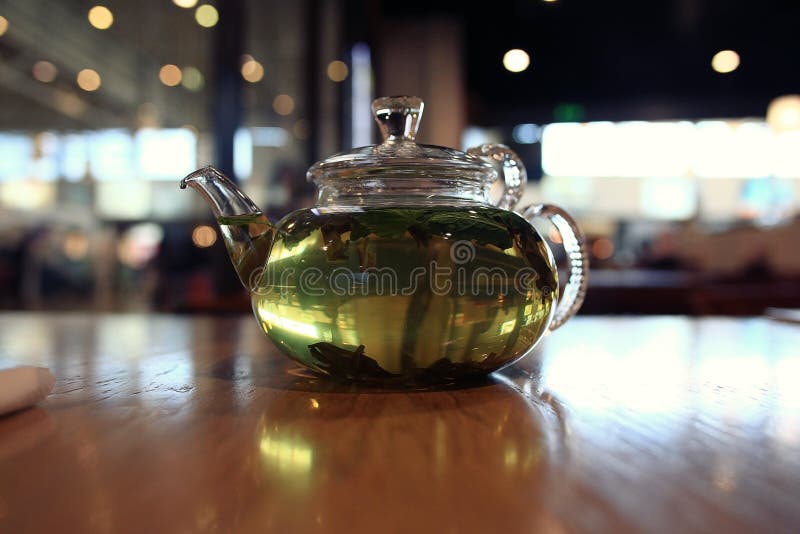 Green tea in a teapot stock photo. Image of healthy, flower 55881956