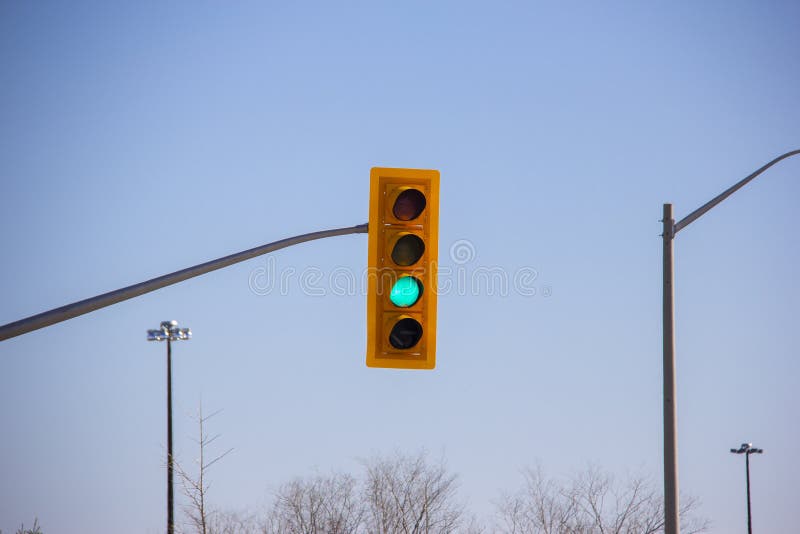 Red Traffic Light Over an Intersection Stock Image Image of green
