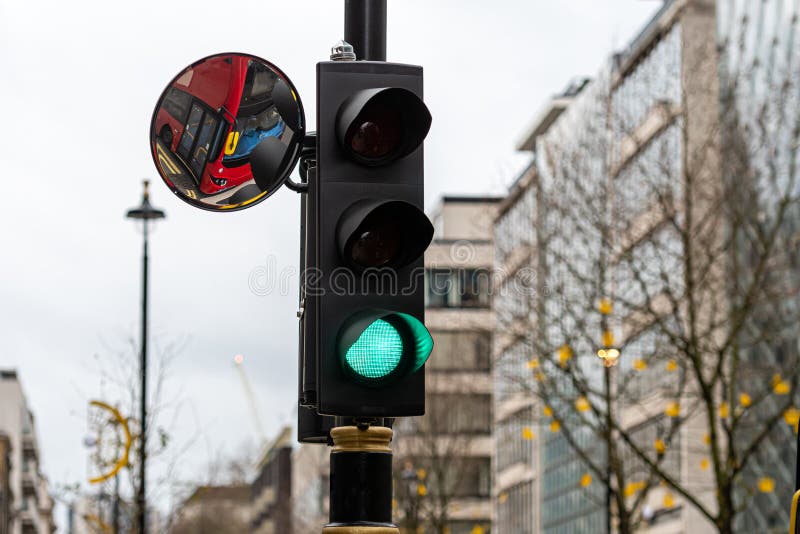 Green Traffic Light Signal and Traffic Convex Mirror with the Reflection of the Vehicle, London, England, Photo - Image of europe, danger: 172909018