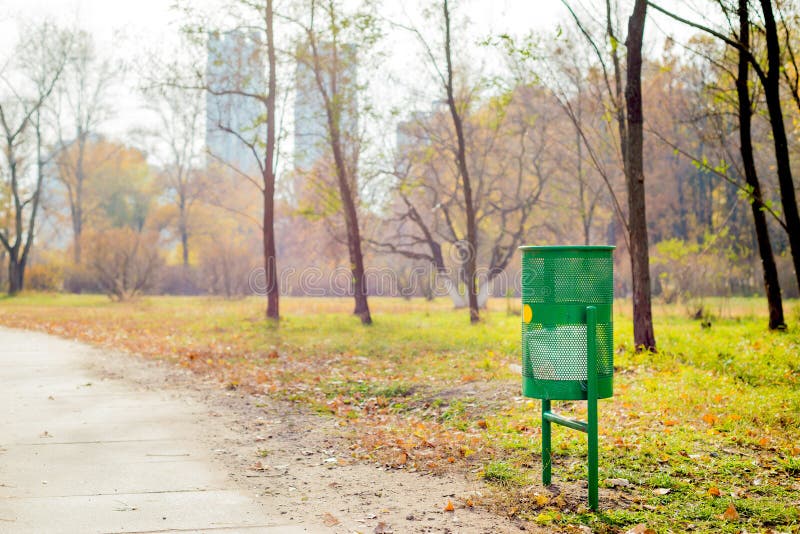 Green Trash Bin in the Park royalty free stock photography