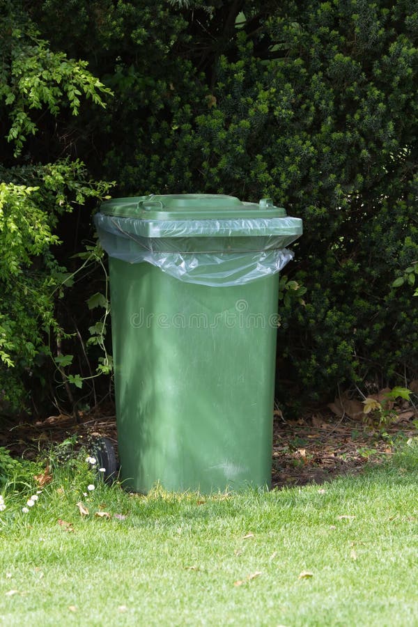 Green trash can stock photography