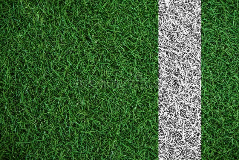 Green turf grass texture with white line, in soccer field