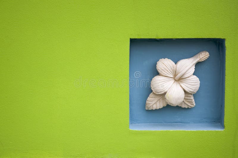 Green wall with stone flower