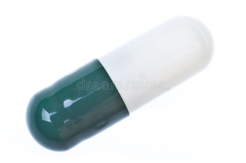 Green and white capsule stock photo. Image of dosage 44896834