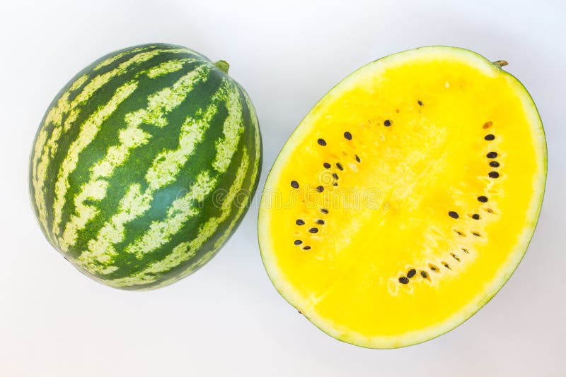 Green with White Stripes Watermelon. Half of Yellow Watermelon Stock