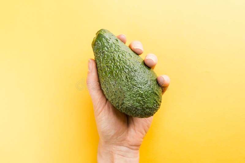 Green Whole Avocado on Yellow Stock Image - Image of lifestyle, food ...