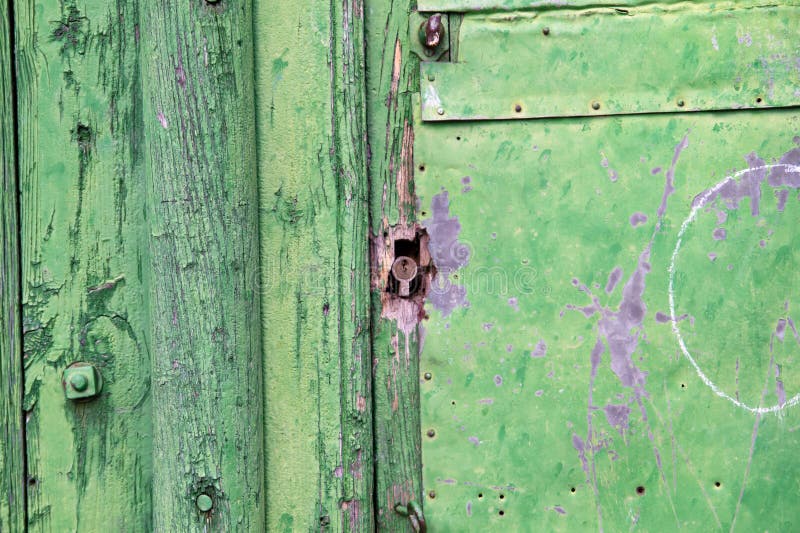 Green wooden panels. Ancient door