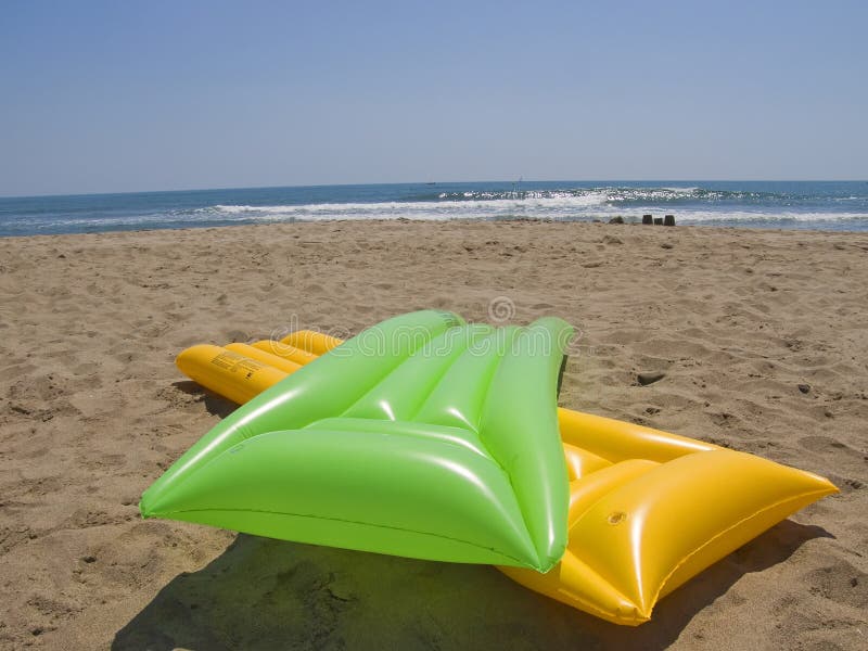 green and yellow air mattresses