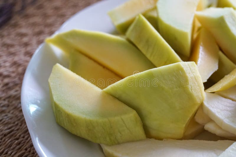 Green Yellow Crispy Mango Sliced in a White Plate Stock Image Image