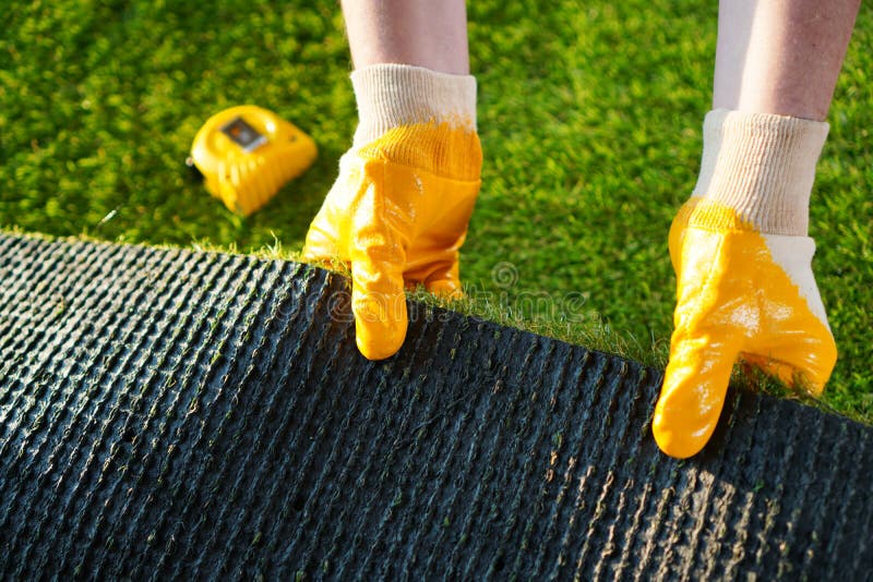 Greenering with the green artificial grass background. stock photo