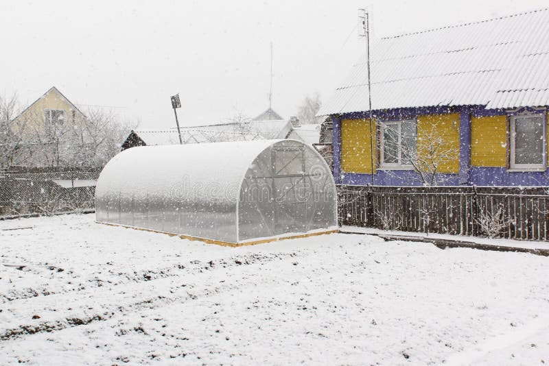 Greenhouse and snow stock images Greenhouse and snow stock images