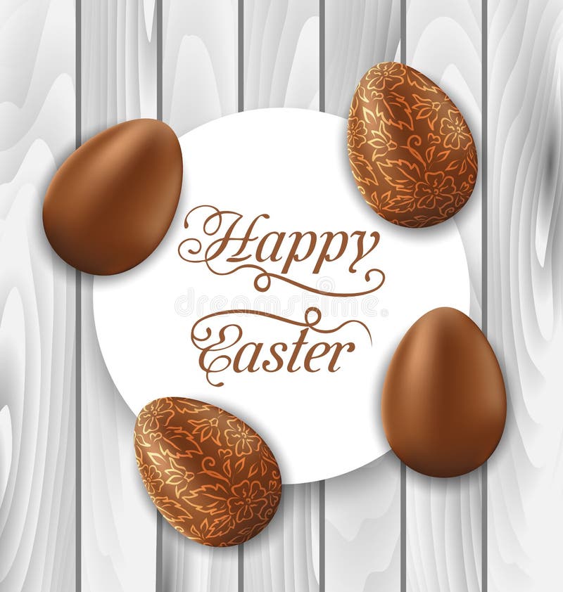 Greeting card with Easter chocolate ornamental eggs on wooden ba