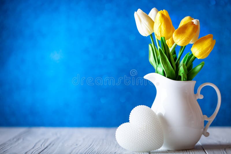 Greeting card with flowers and heart. Background with copy space. Selective focus. royalty free stock image