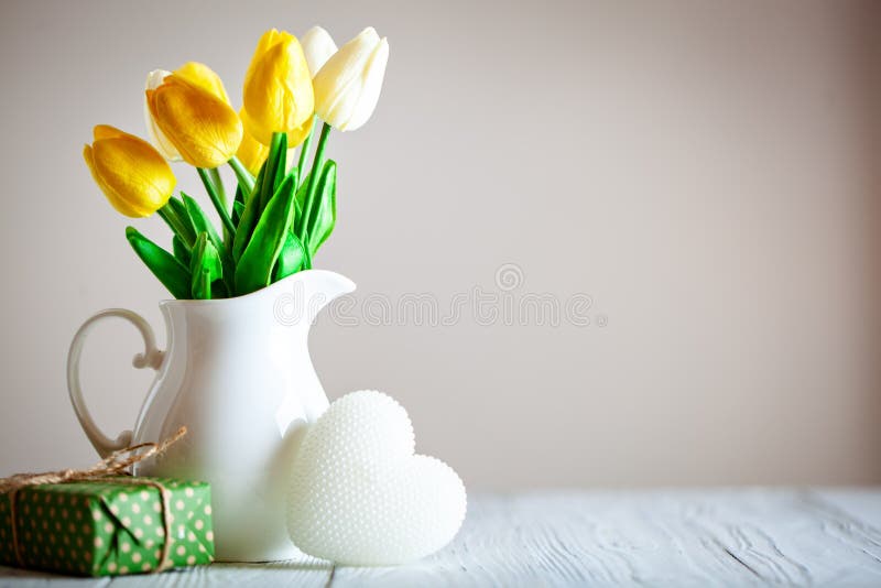 Greeting card with flowers and heart. Background with copy space. Selective focus. royalty free stock photo