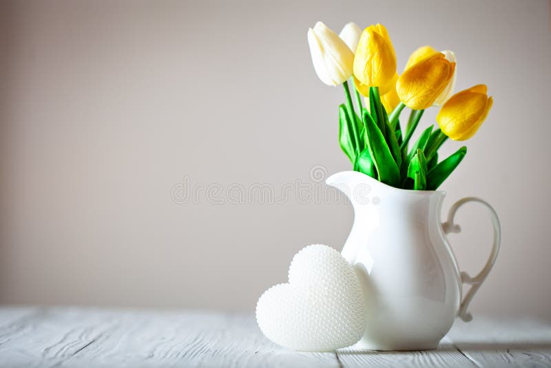 Greeting card with flowers and heart. Background with copy space. Selective focus. stock images