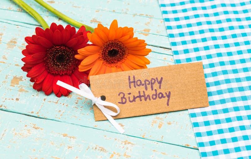 Happy birthday greeting card with fresh colorful flowers on blue wooden table. Happy birthday greeting card with fresh colorful flowers on blue wooden table