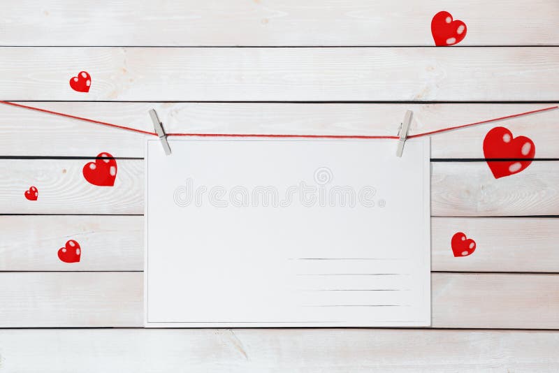 Greeting Card With Space For Text Hanging On A Red Thread Over A