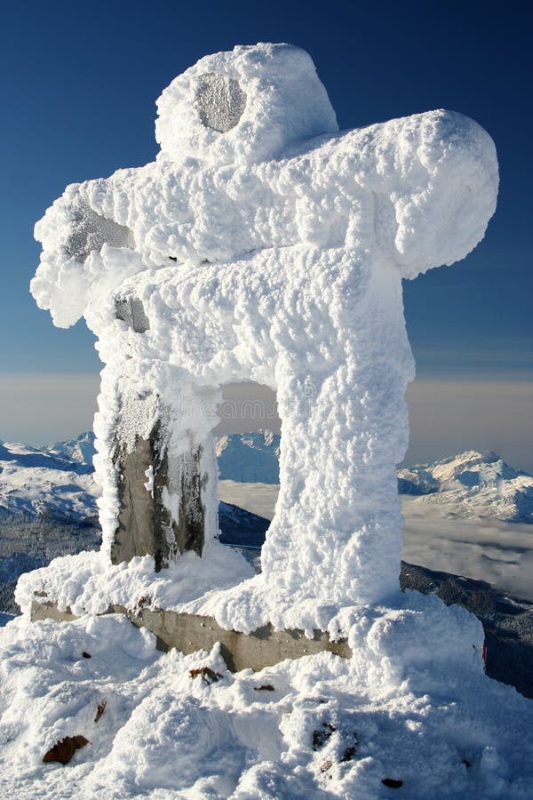 A snow covered Inuksuk, traditional native design and official symbol of the 2010 winter olympics, welcomes visitors to Whistler, BC. A snow covered Inuksuk, traditional native design and official symbol of the 2010 winter olympics, welcomes visitors to Whistler, BC.