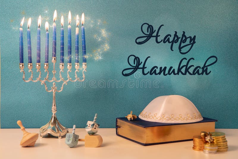 greetings with jewish religious holiday hanukkah with wooden spinning top toy & x28;dreidel& x29; and chocolate coins