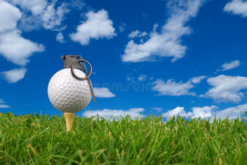 Golf ball grenade from the ground level with grass and cloudy sky. Golf ball grenade from the ground level with grass and cloudy sky