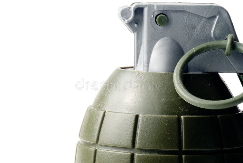 A military hand grenade ready for action. A military hand grenade ready for action.