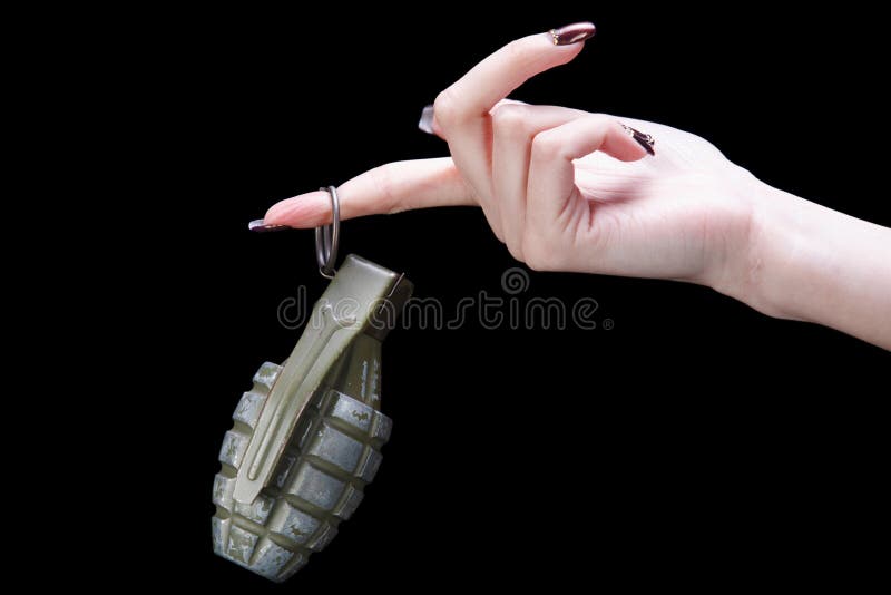 Hand grenade in girl hand on black background. Hand grenade in girl hand on black background