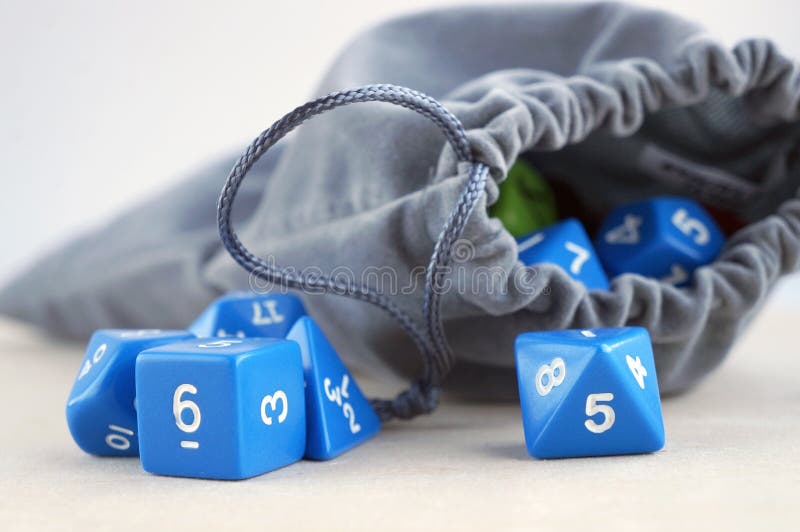 Grey Bag with Dices for Board Games, Tabletop Games or Dnd. Stock Photo