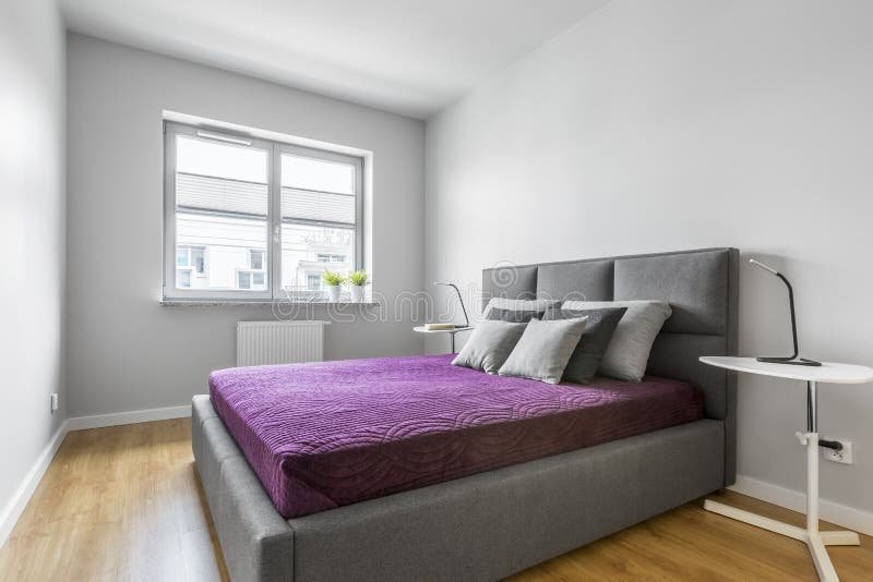 Grey bedroom with double bed stock images Grey bedroom with double bed stock images