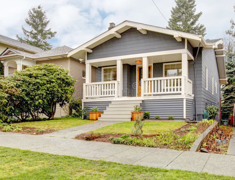 Grey Craftsman Style House with White Porch. Stock Image Image of