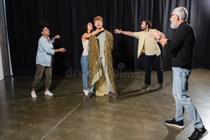 Grey haired art director gesturing near royalty free stock photography