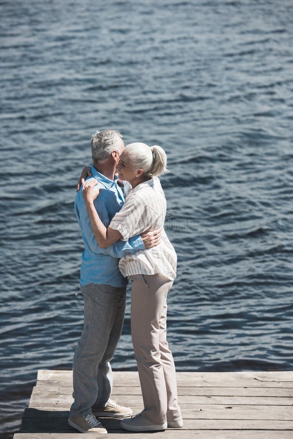 Grey Haired Couple Hugging On Riverside At Daytime Stock Image Image Of Togetherness Stylish