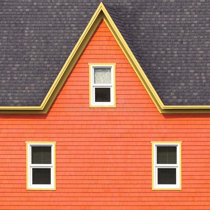 Orange wall, grey roof and yellow window frames