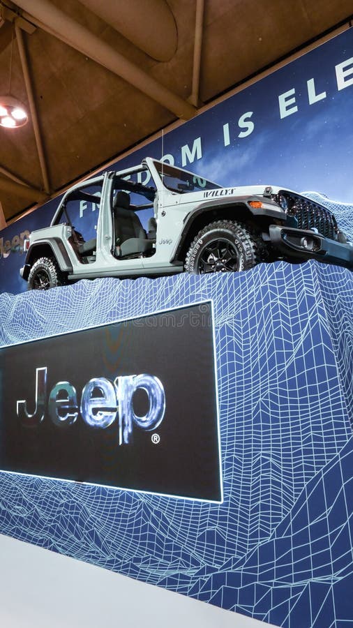 Grey Rubicon Jeep car on display. Crowds looking at new car models at Auto show. National Canadian Auto Show with many car brands stock images