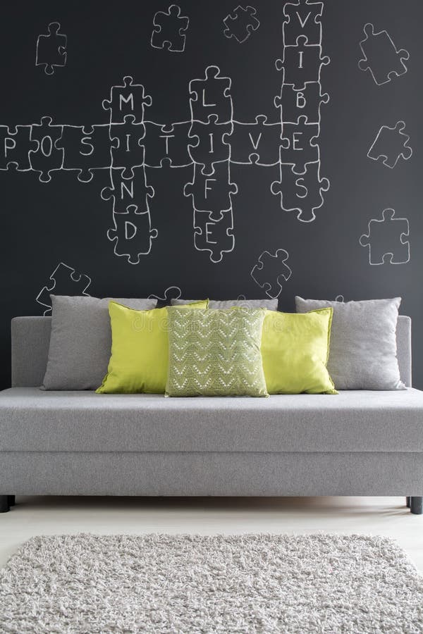 Sofa with Green Pillows and Blanket Standing in Open Space Living Room