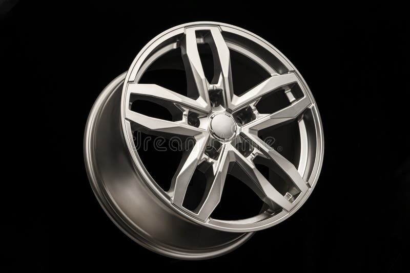 Grey SUV Allloy Wheel, Closeup on a Black Background, Stock Image