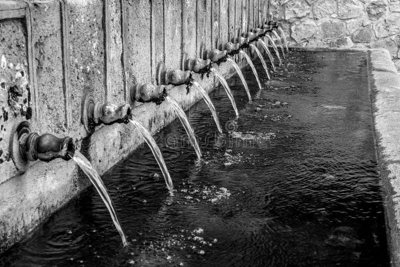 Greyscale Shot of a Water Pipe with Flowing Water Stock Image Image of texture, pipe 256648355