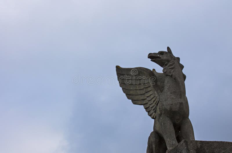 Mythological animal sculpture made of stone at the top. Mythological animal sculpture made of stone at the top