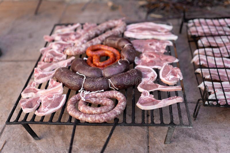 Grill Full with Different Types of Raw Meat Ready for Getting Cooked in