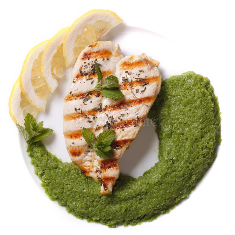 Grillad feg filé och mosade ärtor och bästa sikt för mintkaramell fotografering för bildbyråer Grillad feg filé och mosade ärtor och bästa sikt för mintkaramell fotografering för bildbyråer