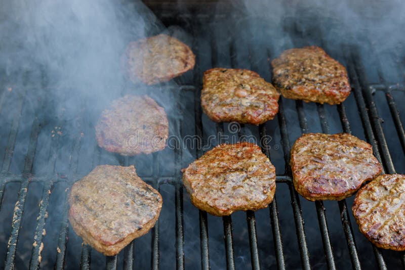 Grilled American Beef Burgers are Cooked on a Over Hot Grill Stock ...
